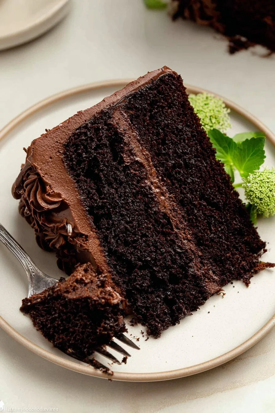Moist, decadent chocolate zucchini cake with glossy chocolate frosting